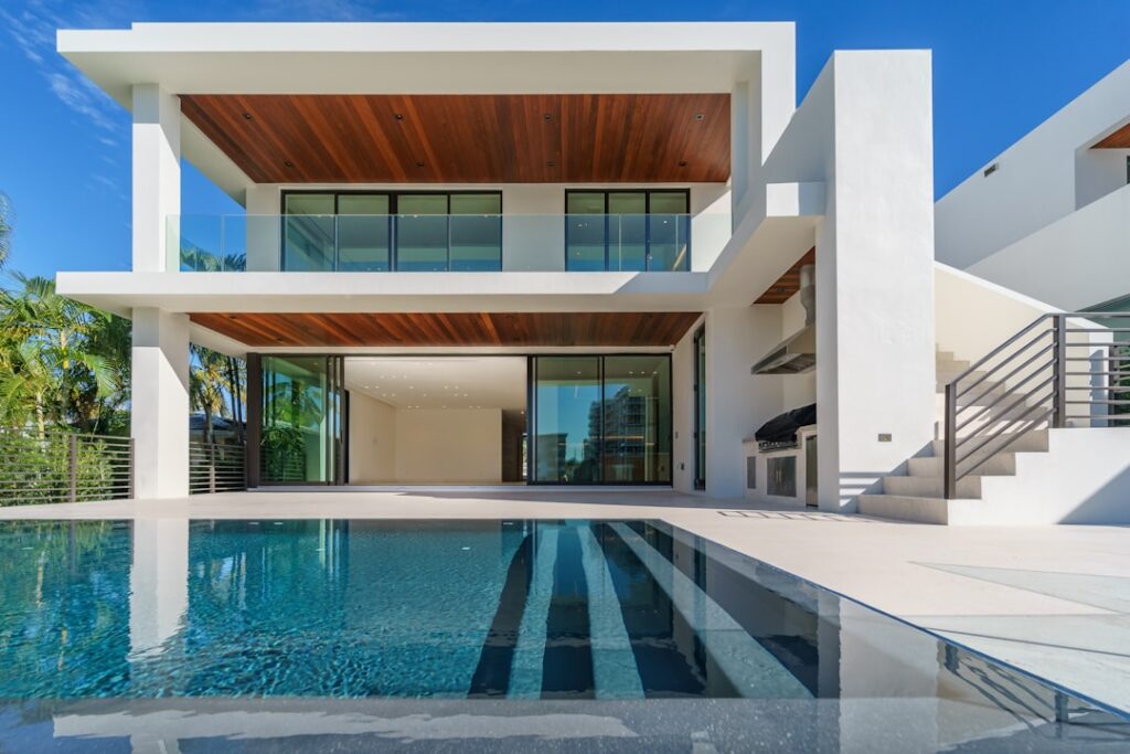Modern luxury residence with large architectural windows representing ACS Global integrated building systems
